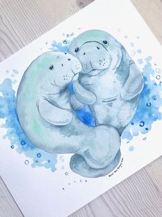 two elephants hugging each other on top of a piece of paper with watercolor paint