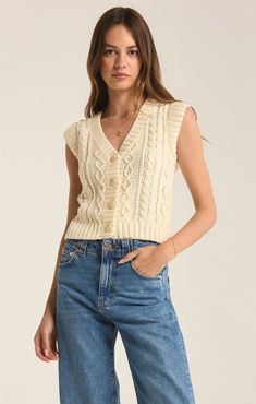 We're loving this all-season cable knit cropped sweater vest. With its cap sleeves, wooden button front and v neckline, this top will instantly elevate your casual look. Cropped Sweater Vest, Spaghetti Strap Bodysuit, Knit Cropped Sweater, Cable Stitch, Strapless Tops, Loungewear Sets, Party Tops, Denim Pant, Black Maxi Dress