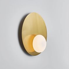 a round light fixture mounted on the wall