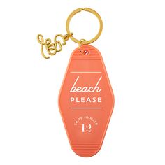 the beach please keychain is pink and has a gold metal hook on it