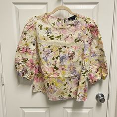 Nwot. Size Medium. Cream And Pastel Colored Floral Pattern Blouse. Puff Short Sleeves. Keyhole And Button At Back Neck. Unlined. No Trades. K-44 Spring Purple Tops For Daywear, Purple Cotton Blouse For Day Out, Purple Floral Print Tops For Brunch, Feminine Purple Cotton Blouse, Purple Floral Print Top For Daywear, Purple Cotton Blouse With Floral Print, Floral Blouse, Blouse Patterns, Floral Pattern