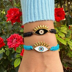 Evil Eye Bracelets by Irene Andrea Jewelry *Well let's see Evil Eye's symbolism!  In many cultures, the evil eye is regarded as a symbol of Protection from the negative energy, while it attracts positivity! This time I chose to create two lovely evil eye bracelets! If you have visited Greece, it's sure that you will have noticed that most people are wearing evil eye jewelry! The reason is that our religion believes that the evil eye charms are protecting us from the "Kako Mati" (Κακό Μάτι)! Thes Bohemian Evil Eye Bracelet With Adjustable Cord, Bohemian Braided Bracelet With Evil Eye For Friendship, Bohemian Gold Braided Bracelet With Evil Eye, Handmade Symbolic Adjustable Braided Bracelets, Gold Bohemian Braided Bracelet With Evil Eye, Adjustable Symbolic Friendship Bracelet, Bracelets Evil Eye, Symbole Protection, Eye Bracelets