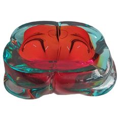 a glass bowl with two faces on it