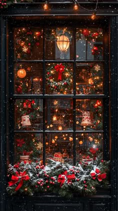 a window with christmas decorations and lights on it