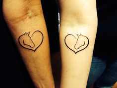 two people with matching tattoos on their arms, one has a horse and the other has a heart