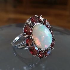 Rare Size 14 X 10 Mm Ethiopian Opal, Garnet And Topaz Sterling Ring Designed By Paul Deasy. 3.5 Carots Of Garnet.. Appraised $855!!!!! True Halo Affect Totally Natural. Never Worn!! Ruby And Opal Ring, Red Garnet Ring, Ring Color, Garnet Rings, Opal Ring, Red Garnet, Opal Rings, Womens Jewelry Rings, Sterling Ring