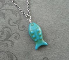 This listing is for a blue fish charm necklace. You'll be able to choose your chain length and style at checkout by using the "Chain Length/Style" drop-down menu. **Please see the second photo for scale! If you're on the mobile site, just swipe to the side. :)- - - - - - -This is our third shop for jewelry. If you're looking for something a bit more "personalized", then just follow these links:www.etsy.com/shop/metalspeakwww.etsy.com/shop/metalspeaktoo- - - - - - -Thank you so much for dropping Turquoise Charm Necklace With Lobster Clasp As Gift, Fish Items, Fishing Necklace, Howlite Jewelry, Pinterest Wardrobe, Howlite Necklace, Fish Jewelry, Fish Necklace, Fishing Gift