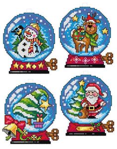 four snow globes with santa claus and other christmas decorations on them, all in different designs