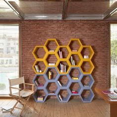 a book shelf made out of hexagonal shelves