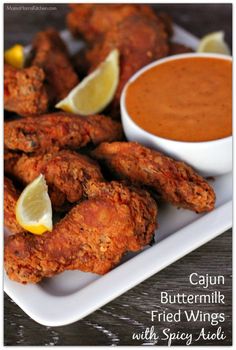 fried wings with spicy sauce on a white plate