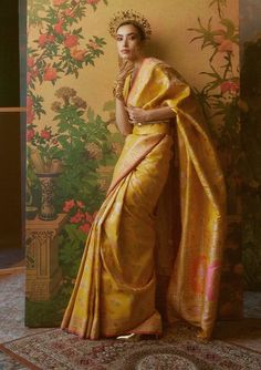 Editors Note Celebrate in style with the handwoven yellow tissue sari. Rich festive colors meet detailed paisley motifs, showcasing classic Indian craftsmanship, inspired by the jamawars of kashmir. A blend of tradition and elegance, it's the perfect pick for any celebration. Ekaya Banaras, Yellow Silk Saree, Yellow Sari, Green Sari, Editors Note, Sarees Banarasi, Formal Saree, Paisley Motifs, Sarees Silk