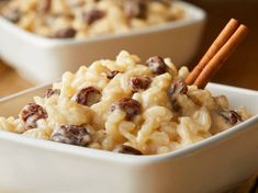 two white bowls filled with macaroni and cheese