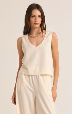 Our popular Sloane V-Neck Top now comes in this flattering v-neck version. Lightweight and made of cotton jersey fabric, this relaxed top is a versatile and effortless everyday piece, meant to be worn on its own. Palm Green, Maxi Jumpsuit, Athleisure Tops, Silk Bottoms, V Neck Tank Top, Leather Denim, Neck Crop Top, V Neck Tops, Sea Salt