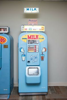 two old fashioned milk dispensers are on display