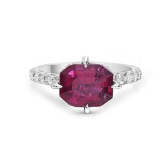 an oval shaped ruby and diamond ring