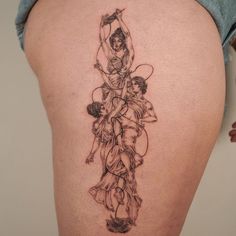 a woman with a tattoo on her thigh