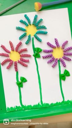 the paper flowers are made with colored crayons