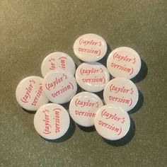 six white buttons with red words on them that say taylor's decision and taylor's version