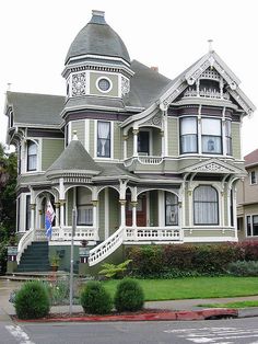 an old victorian style house with many windows and balconies