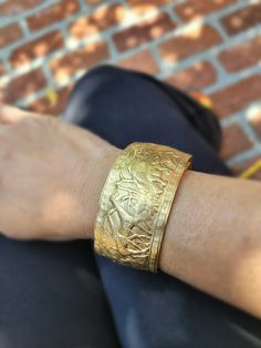 This stunning safari pattern cuff bracelet speaks for itself. Gorgeous design of giraffes and elephants wraps around the whole bracelet.  Brass is an excellent option for those who love gold tones  The size of this cuff fits any small to medium size wrist. It can be adjusted because it is open 1 inch. It is made to be squeezed to size.  I use thick 1.5mm metal so she's not flimsy!! Also available in sterling silver! You won't be dissapointed! I hand press and polish all of my designs Please ask me if you have questions. Luxury Traditional Metal Cuff Bracelet, Luxury Silver Brass Cuff Bracelet, Lion Bangle Gold, Safari Pattern, Men’s Lion Bracelet, Elephant Bangle, Animal Bracelet, Elephant Jewelry, Gorgeous Design