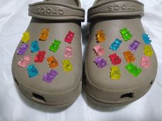 a pair of crocs with gummy bears on them