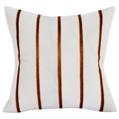 a white and brown striped pillow on a white background