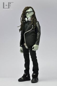 a doll with long hair and glasses is dressed in black