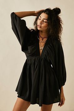 The definition of romantic, this mini from our free-est collection will turn heads with every wear. **Fit:** Relaxed, A-line silhouette **Features:** Plunge V-neckline, billowy banded sleeves, smocked waist, back keyhole button closure **Why We | For The Moment Mini Dress by free-est at Free People in Black, Size: XS Dirndl Outfit, V Neck Tunic, Barbie Mode, Bandeau Tops, Flowy Mini Dress, Mini Robes, Beach Skirt, Party Dress Short, Puff Sleeve Dresses