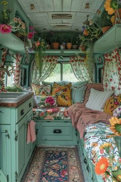 the interior of an rv decorated with flowers and plants