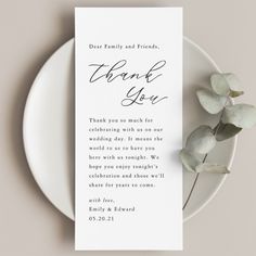 a white plate with a card that says thank you