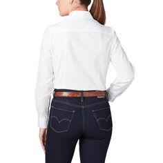 The Dallas is a chic, cotton women's shirt featuring a shirttail hem yoke with a subtle, embroidered mirrored-L emblem on the pocket. Model is 5'8 and wearing size S. Classic Blouse With Placket, Slim Fit Blouse With Button Cuffs, Cotton Shirt With Shirttail Hem, Fitted Cotton Blouse With Concealed Placket, Business Casual Shirt With Concealed Placket, Elegant Cotton Shirt With Shirttail Hem, Business Casual Cotton Blouse With Shirttail Hem, Cotton Blouse With Spread Collar, Cotton Blouse With Shirttail Hem For Business Casual