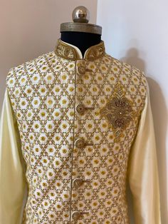 Beige rawsilk Nehru Jacket with Resham and Zari embroidery and pearl highlights. Includes- Nehru jacket with raw silk kurta set. Colour and customisation options available for kurtas set and Nehru jacket . Any queries plz msg us. Elegant Naqshi Choli For Festive Occasions, Raw Silk Sherwani With Naqshi For Reception, Festive Traditional Wear With Naqshi For Reception, Festive Gold Nehru Jacket With Traditional Drape, Gold Nehru Jacket For Festive Occasions, Gold Sherwani With Intricate Embroidery In Raw Silk, Traditional Gold Raw Silk Bandhgala, Traditional Bandhgala For Reception During Diwali, Traditional Gold Bandhgala In Raw Silk