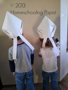 two children with paper bags on their heads