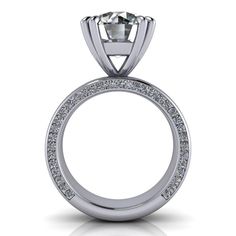 10mm, 3.60 ct., Round Colorless Moissanite, DEF Color, VVS Clarity. Channel Set Round colorless moissanite, 1.00 ct. Band width: 5.6mm 4.60 carat total weight. *The ring is custom made just for you in your ring size and metal preference. Order a free ring sizer here.*Please contact us prior to purchasing with any questions, we are happy to help. Modern Moissanite Wedding Ring With Center Stone, Moissanite Channel Set Round Cut Ring, Luxury Channel Set Round Cut Diamond Ring, Channel Set Cubic Zirconia Diamond Ring, Luxury Moissanite Rings With Channel Set, Fine Jewelry Moissanite Diamond Ring Channel Set, Modern Moissanite Round Cut Wedding Ring, Dazzling Channel Set Round Cut Diamond Ring, Dazzling Channel Set Diamond Ring With Round Band