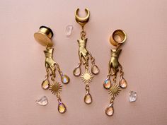 Gold 'Ethereal Touch' Dangles | The Frilly Feline Earrings Gauges, Dangle Plugs, Gauge Earrings, Brass Hand, Magical Jewelry, Gauged Earrings, Plugs Earrings, Drop Dangle Earrings, Faceted Glass