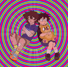 two people sitting on top of each other in front of a colorful background with circles