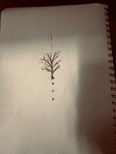 a drawing of a tree on paper with water drops coming out of the top and bottom branches