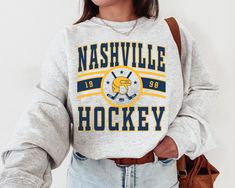 "WELCOME TO MY STORE ♥️ This Nashville Predator, Vintage Nashville Predator Sweatshirt \\ T-Shirt, Predators Sweater, Predators T-Shirt, Hockey Fan Shirt, Retro Nashville Ice Hockey. Please check Color and Size Charts before placing the order. You can find them in the listing's photos (Depending on what device you are viewing this listing colors may vary slightly). Returns and exchanges are accepted only if there are defects \"No Extra Costs\" _UNISEX T-SHIRT * 100% cotton for solid colors * Hea Florida Panther, Sweat Vintage, New York Vintage, Star T Shirt, Jersey Vintage, Ottawa Senators, Columbus Blue Jackets, Buffalo Sabres, Winnipeg Jets