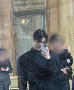 a man taking a selfie in front of a mirror