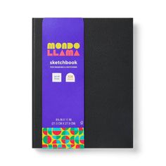 a black notebook with colorful writing on the front and back cover, sitting on a white surface