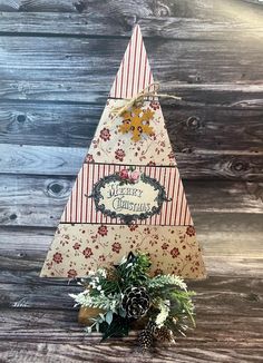 a small christmas tree on top of a wooden table