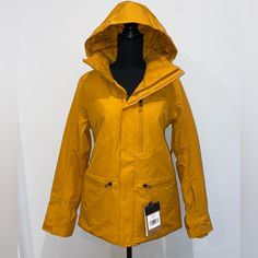 Yellow/Orange North Face Women’s Coat With Detachable Hood. Brand New With Tags. Size: Sp Functional Orange Outerwear For Fall, Yellow Waterproof Winter Outerwear, Yellow Weatherproof Winter Outerwear, Winter Weatherproof Yellow Outerwear, Yellow Outdoor Outerwear With Detachable Hood, Mustard Outerwear For Fall Outdoor Activities, Mustard Outerwear For Fall Outdoor, Yellow Weatherproof Hooded Outerwear, Yellow Weatherproof Outerwear For Outdoor Activities