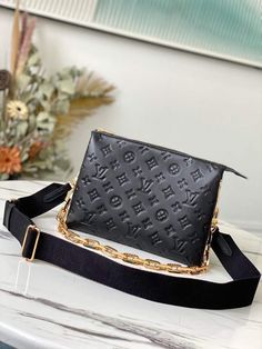 Description L.V Coussin PM Monogram Embossed Puffy Black For Women, Women’s Handbags, Shoulder And Crossbody Bags 10.2in/26cm LV M57790 Rep 1:1 One of the stars of the Spring-Summer 2021 show, the Coussin PM handbag is made from Monogram-embossed puffy. It can be worn cross-body with the strap, as a chain baguette, or comfortably carried under the arm. The pillow-like Coussin bag brings style to the most simple look, giving it an effortless fashion-forward allure. 26 x 20 x 12 cm / 10.2 x 7.9 x 4.7 inches (Length x height x width) Black Monogram-embossed puffy Microfiber lining Gold-color hardware 3 inside compartments Zip closure Strap: Removable, adjustable Chain: Removable –  Includes box, dust bag. –  This product is of the best quality. Lv Bag, Black Handbags, Vuitton Handbags, Bago, Louis Vuitton Handbags, Look Fashion, Wallet Case, Louis Vuitton Bag, Luxury Bags