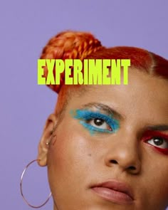 a woman with red hair and blue makeup has the words experiment painted on her face