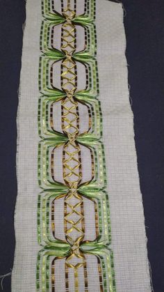 a close up of a piece of cloth with different designs on the side and sides