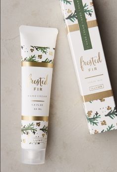 a tube of frosted fir hand cream next to a box on a table top