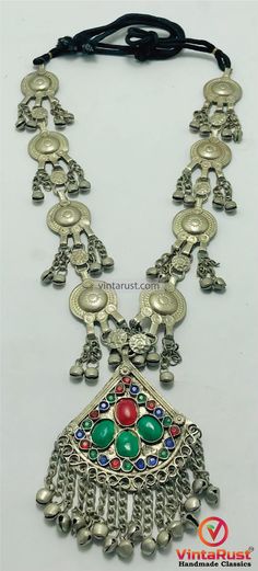 *This traditionally rich Afghani tribal necklace with silver hued tribal dangling coins is one of a tantalizing piece of tribal jewelry from our collection. This necklace is a perfect addition to your jewelry collection. The coin pendants all over the necklace makes this ethnic jewelry piece one of the unique designs. This ethnic necklace has a pendant beautified with multihued glass stones.  *This Kuchi tribal massive necklace is comprised of uniqueness and beauty. The dangling coin tassels increase the charm of this necklace. This statement depicts history and tribal feel. The dangling tassels on the coin pendants make a pleasing sound with every movement. This tribal necklace made by the brilliant craftsmen is a unique and elegant piece of tribal jewelry. *This tribal choker necklace is Festival Coin Pendant Necklace, Bohemian Coin Pendant Necklace For Rituals, Bohemian Coin Necklace, Bohemian Silver Coin Necklace For Festivals, Silver Bohemian Coin Necklace For Festivals, Bohemian Coin Pendant Necklace For Festivals, Bohemian Coin Pendant Jewelry For Festivals, Traditional Metal Coin Necklace For Festivals, Bohemian Dangle Necklaces For Festivals