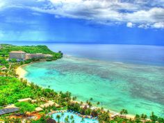 an aerial view of the resort and beach