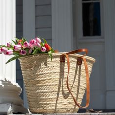 Look chic and smart while you stroll the farmer's market with your classic French tote basket. Switch between two sets of leather handles, long shoulder straps for when you want your hands free and short tote handles when you want to hand-carry your basket. This basket is ready for adventure! Use it as a beach bag, a pool tote, or a spacious picnic basket. When you're home, it makes for an attractive storage option hanging up or in a corner. Keep your basket in your car or display it on a hook n Spring Bucket Bag With Handles, Spring Everyday Bucket Bag With Handles, Classic Straw Tote Bag For Everyday Use, Spring Bucket Bag With Rolled Handles, Everyday Spring Straw Bag With Round Handle, Classic Straw Bag With Braided Handles For Travel, Classic Summer Bags With Leather Handles, Classic Bags With Leather Handles For Summer, Classic Rectangular Straw Bag For Everyday Use