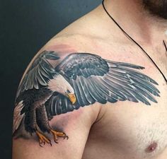 a bald man with an eagle tattoo on his chest